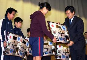 Astronaut Wakata gives shuttle collages to young evacuees